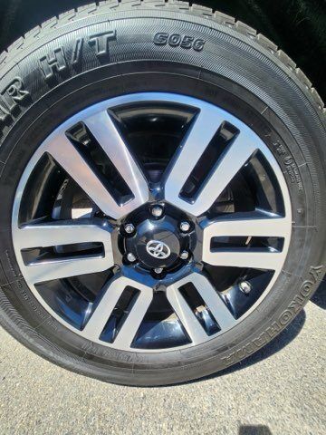 A close up of a car wheel with a tire on it.
