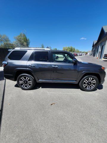 A toyota 4runner is parked on the side of the road.