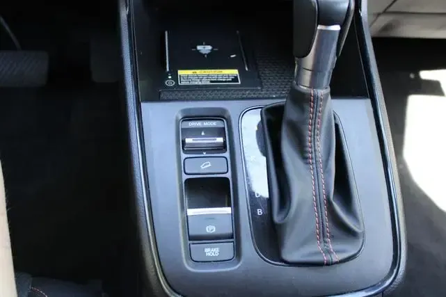 A close up of the shifter in a car