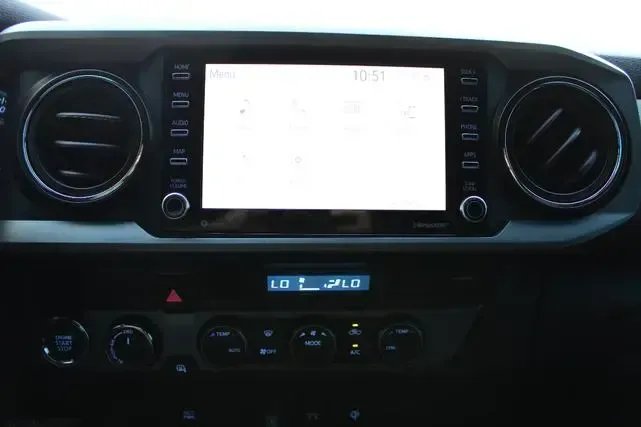The dashboard of a car with a touchscreen display.