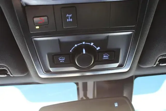 A close up of a control panel in a car
