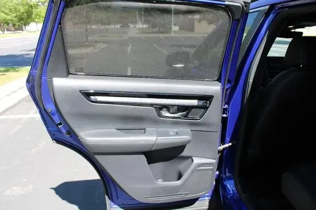 The back door of a blue car is open