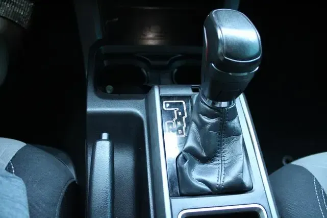A close up of a shifter in a car.