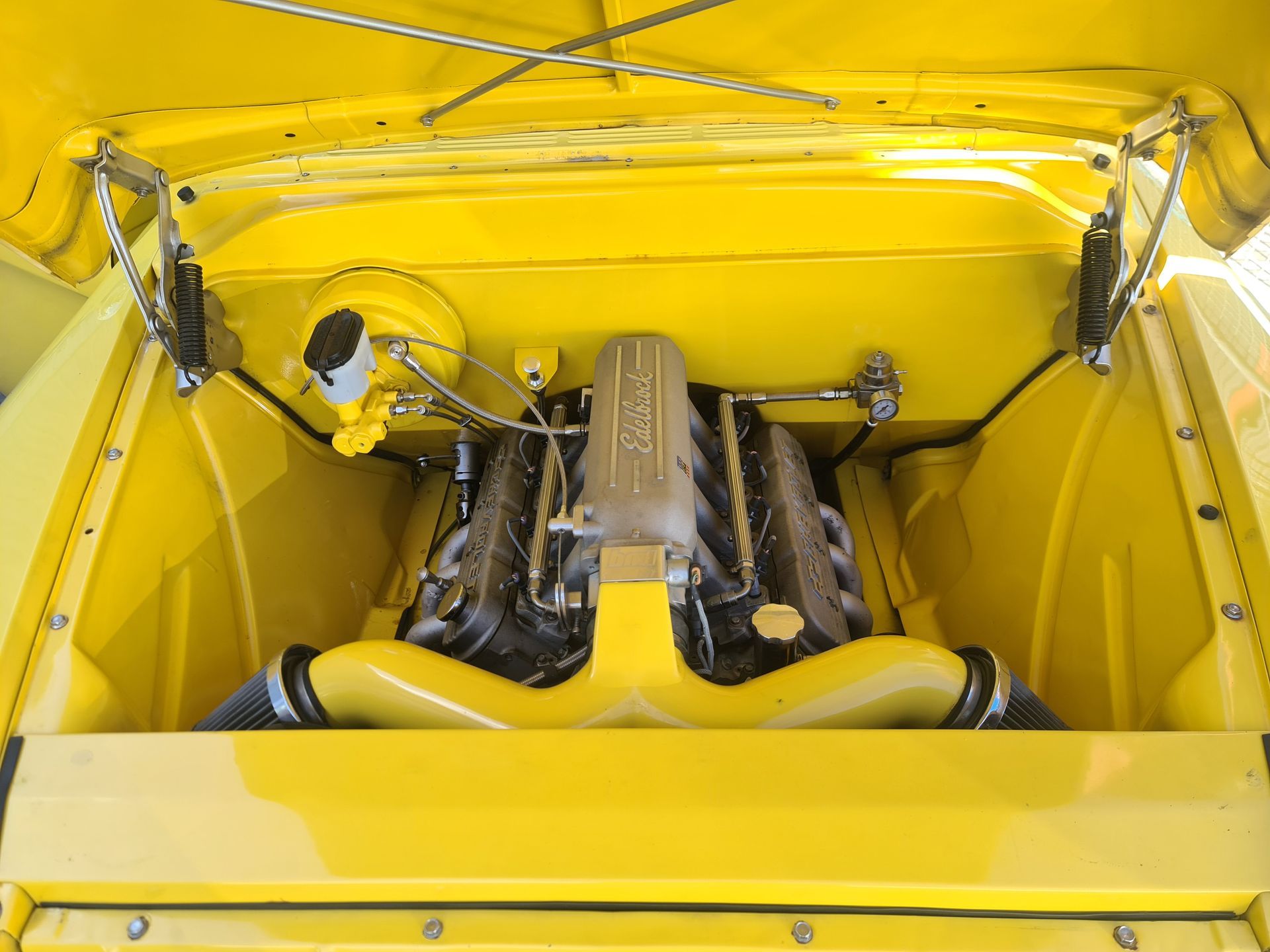 A Man is Fixing a Clutch on a Car With a Wrench — Empire Automotive In Portsmith, QLD