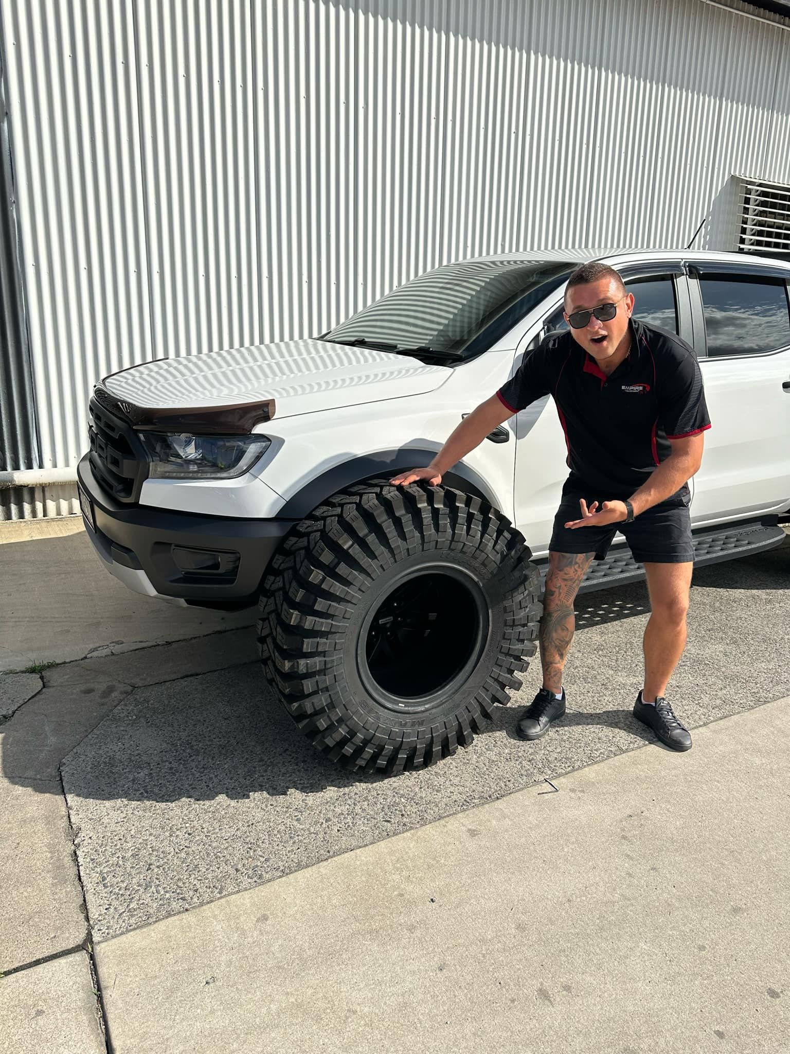 A White Raptor Truck is Parked in a Parking Lot — Empire Automotive In Portsmith, QLD