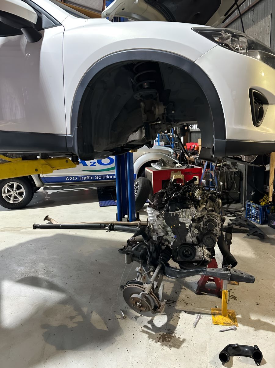 A Car is Being Repaired in a Garage With the Engine Removed — Empire Automotive In Portsmith, QLD