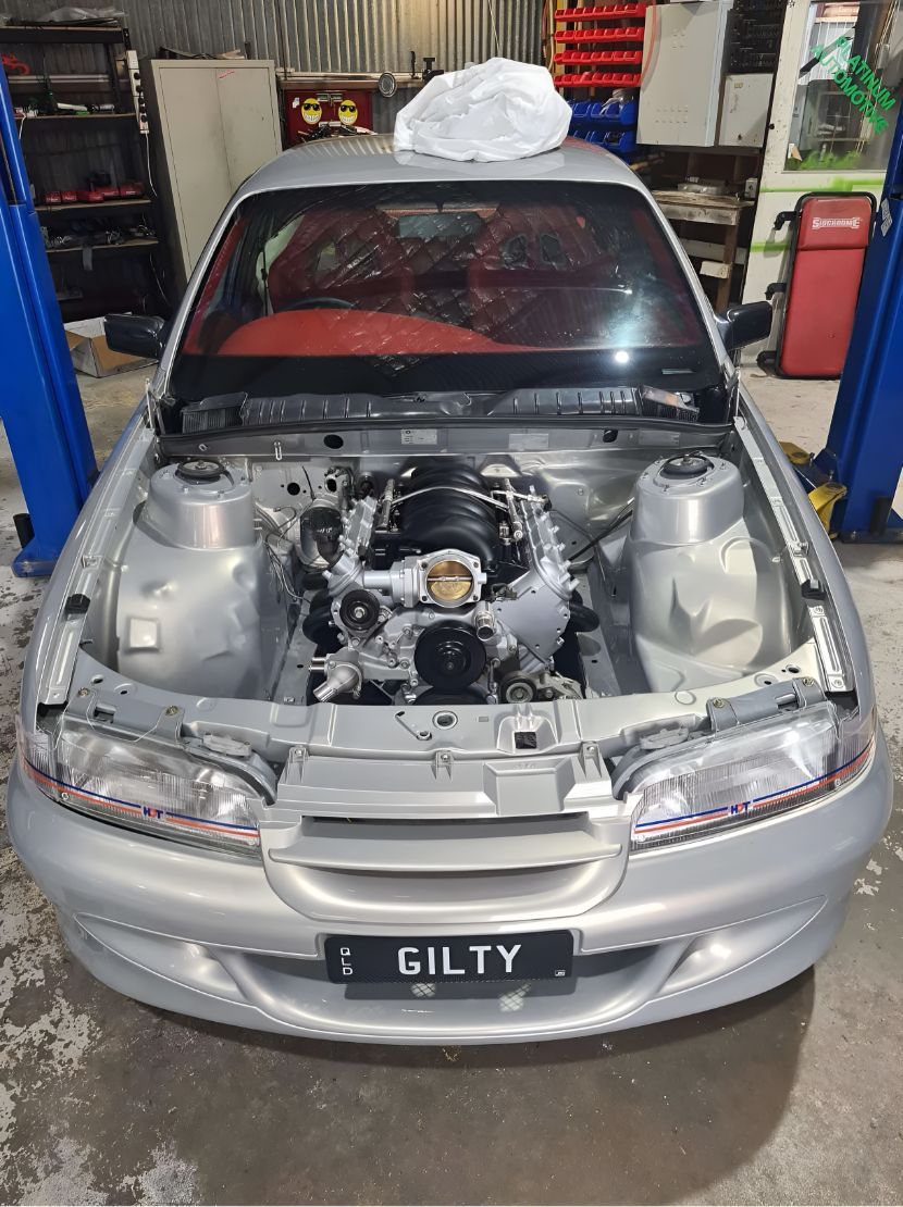 A Silver Car With the Hood Up in a Garage — Empire Automotive In Portsmith, QLD