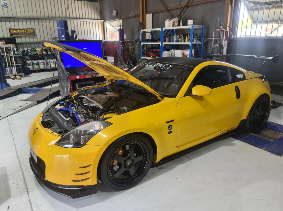 A Yellow Car in a Workshop with it's Hood Open — Empire Automotive In Portsmith, QLD