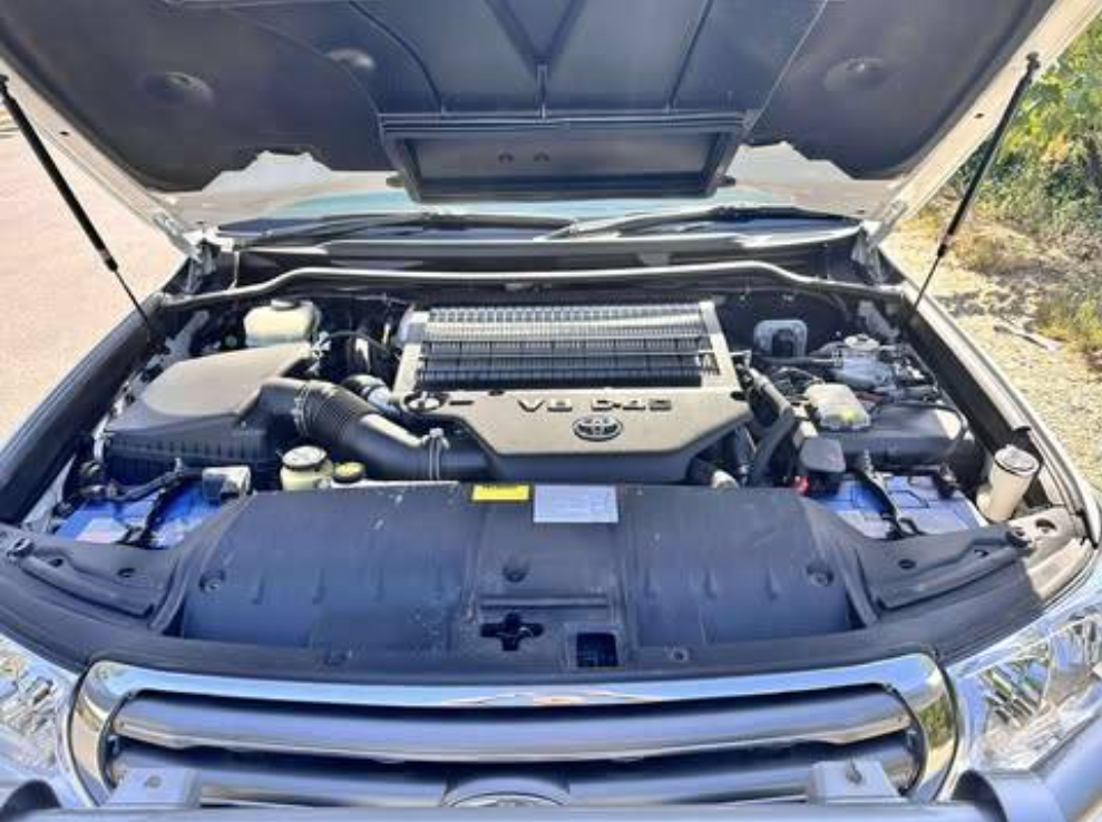 The Engine of a Black Car is Shown With the Hood Open — Empire Automotive In Portsmith, QLD
