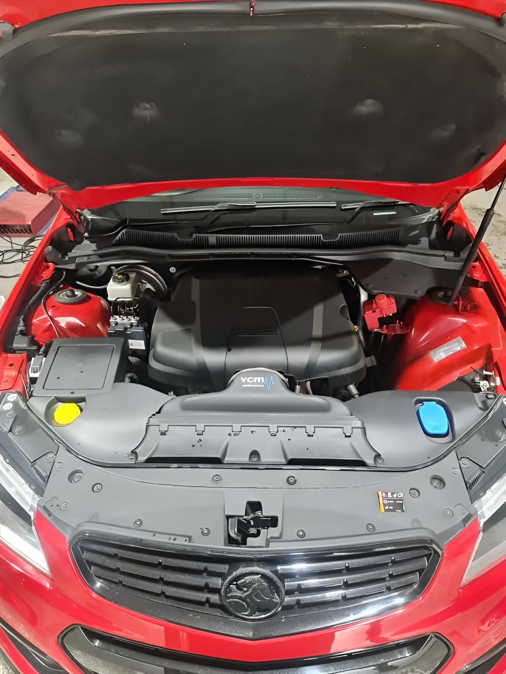 The Engine of a Red Car is Shown With the Hood Open — Empire Automotive In Portsmith, QLD