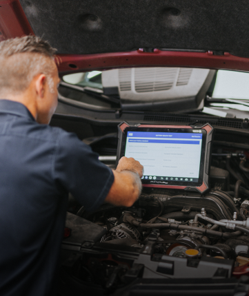 Technician performing computer diagnostics | Andrew's Automotive Repair