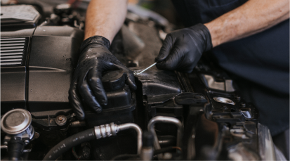 Up close of technician working on engine | Andrew's Automotive Repair