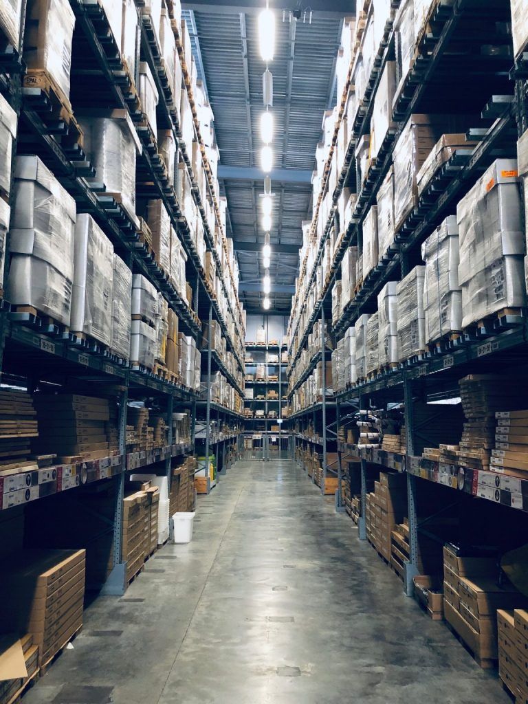 A warehouse filled with lots of boxes and shelves.