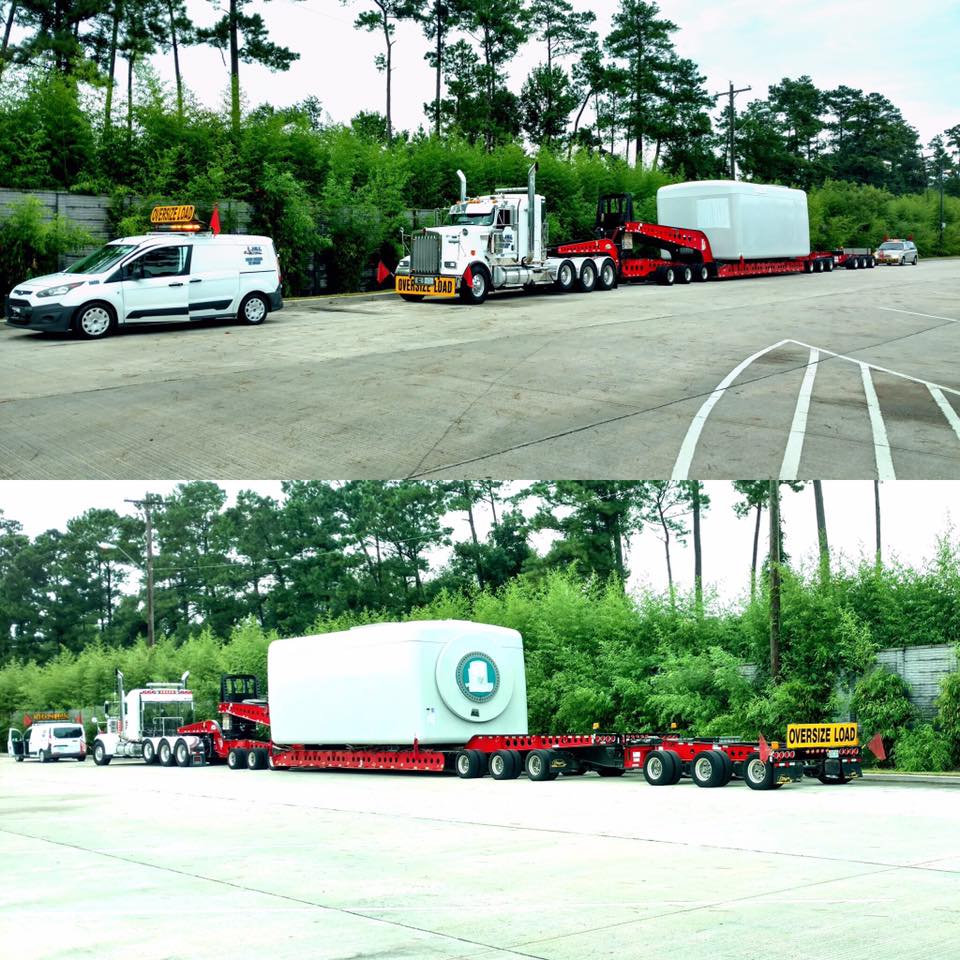 Oversize load of bulldozer is loaded on a flatbed