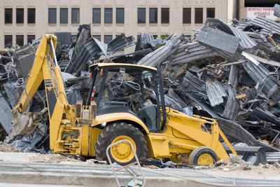 Commercial Demolition — Excavator Demolishing A Commercial Space in Austin, TX