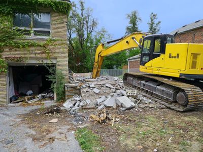 Demolition Austin — Excavator Demolishing A House in Austin, TX