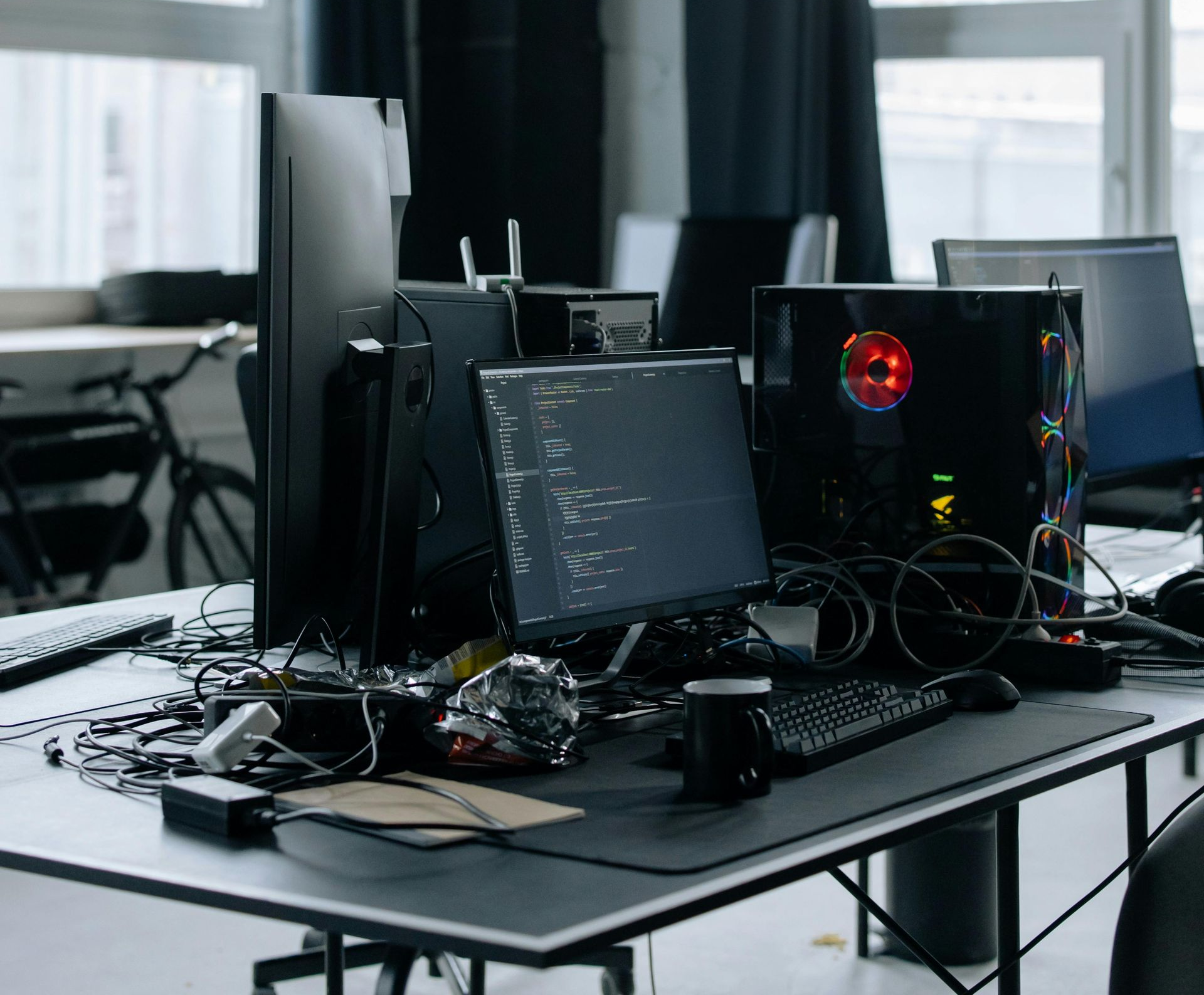 A large pile of shredded white paper sitting on a table next to stacks of uncut paper.