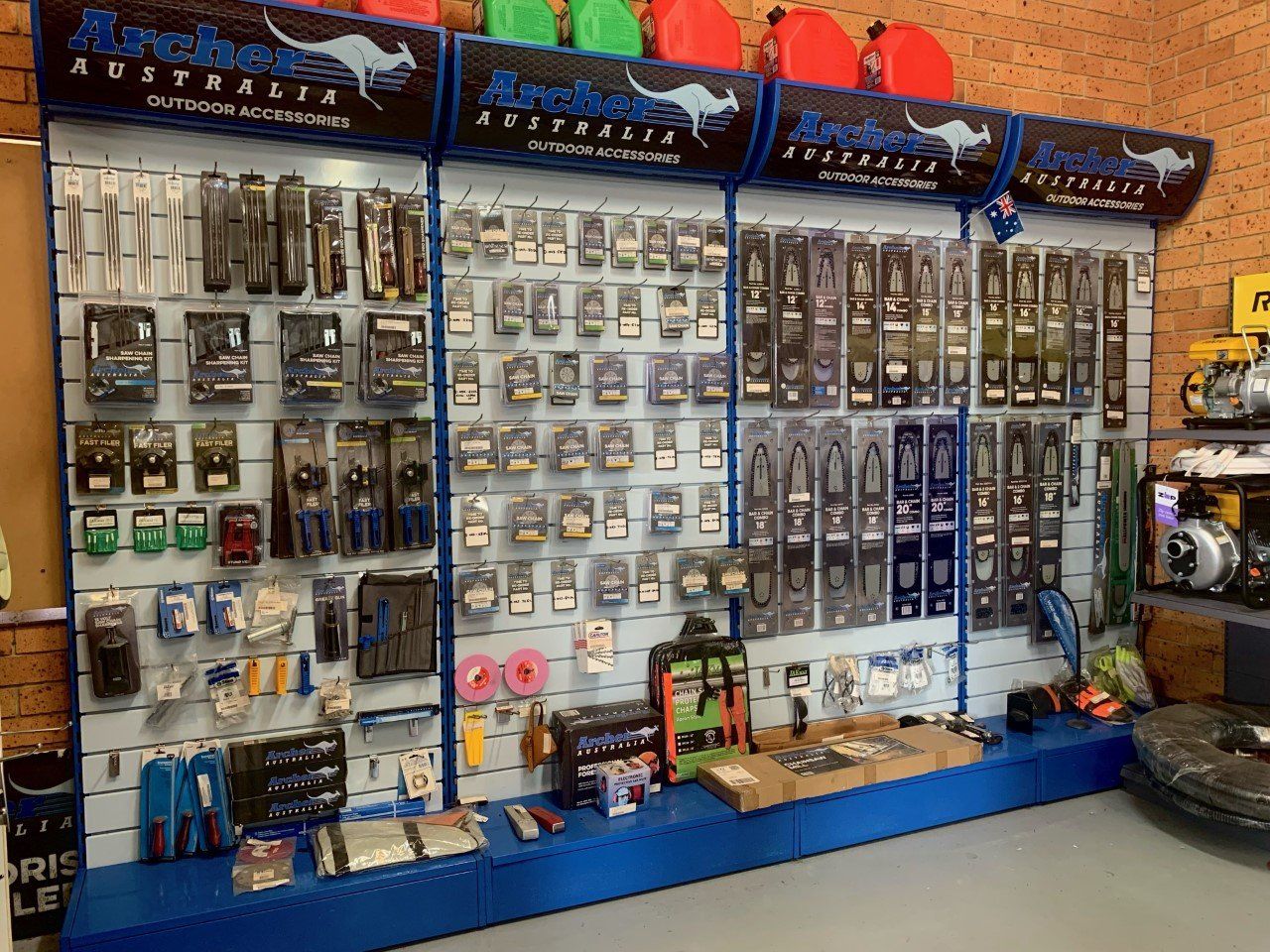 A Wall Filled With Lots of Different Types of Products — Great Lakes Mowers & Chainsaws In Tuncurry, NSW