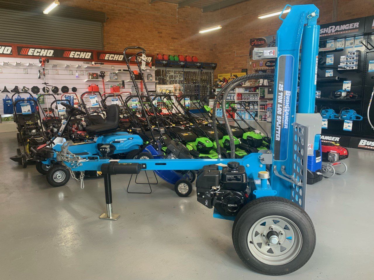 A Trailer With a Crane Attached to It is in a Store — Great Lakes Mowers & Chainsaws In Tuncurry, NSW