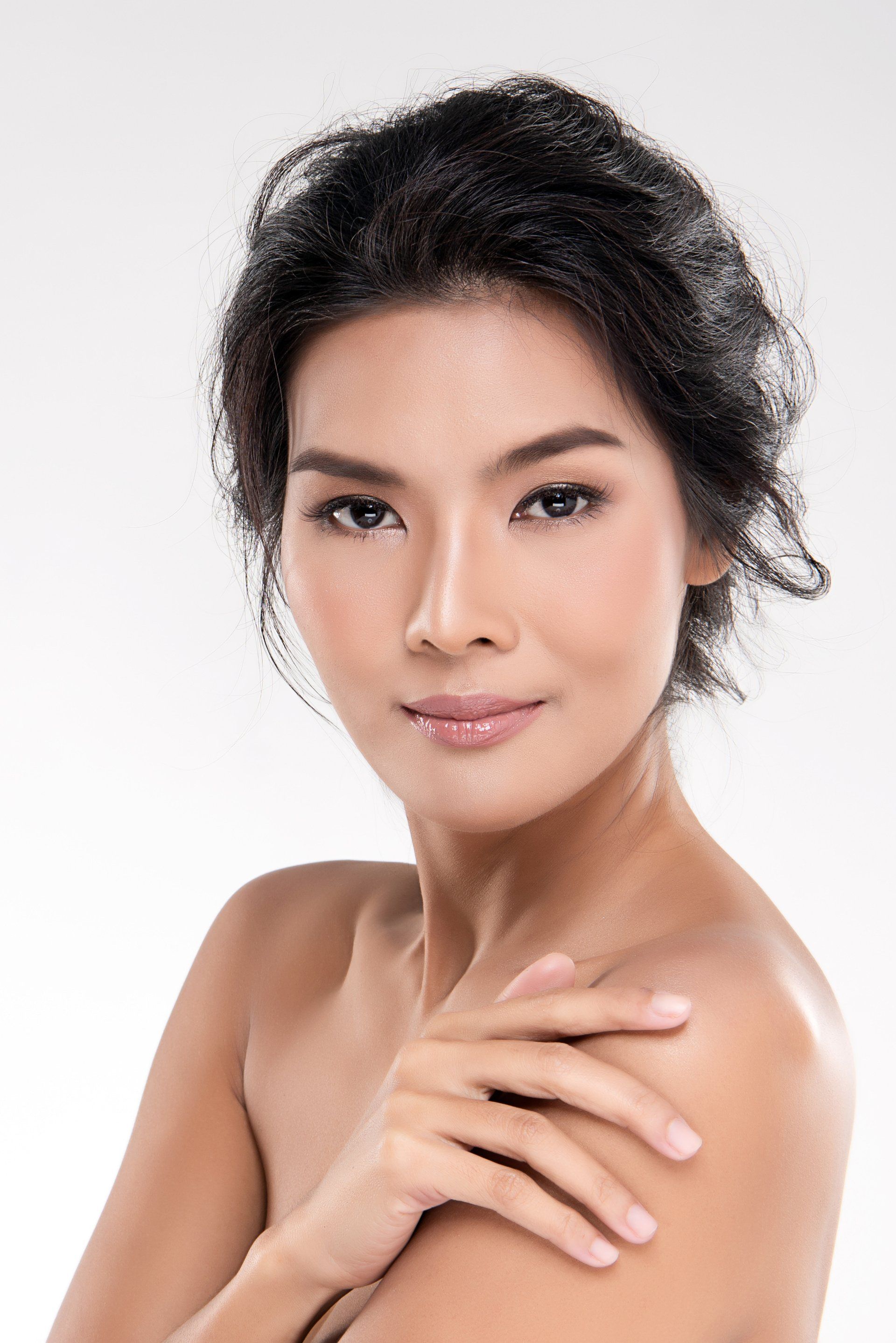 beautiful asian woman in her 30s with glowing skin