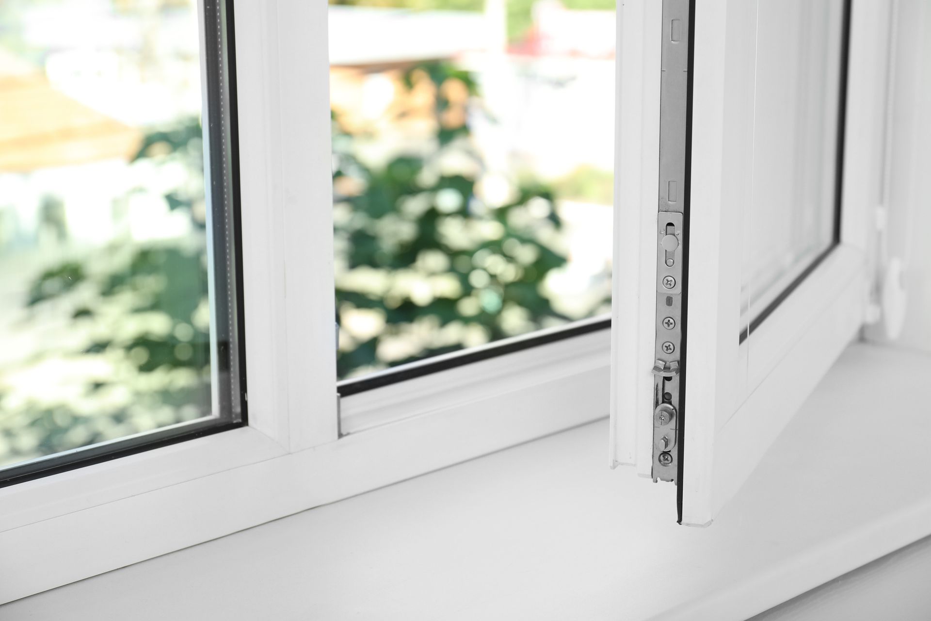 White vinyl window partially open.