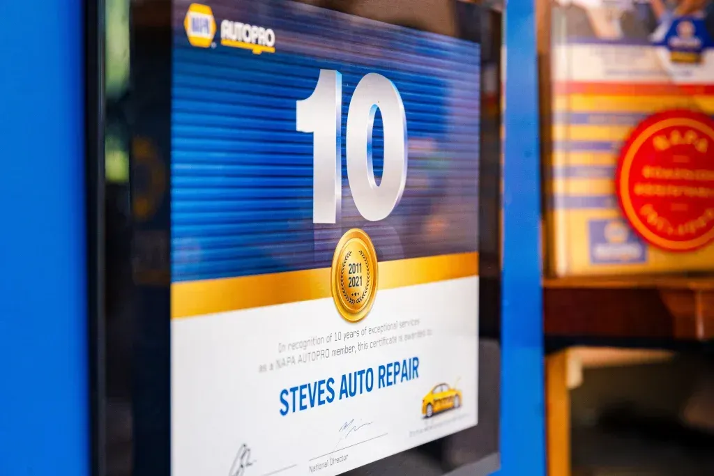 A NAPA Autopro award plaque for 10 years of service displayed at Steves Auto Repair.