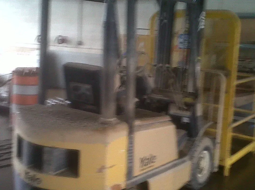 Yellow Yale forklift in an industrial setting.