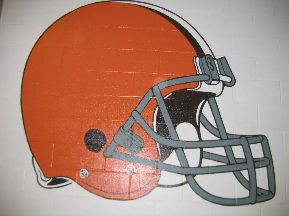 Cleveland Browns football helmet, orange with a gray facemask, on a white background.