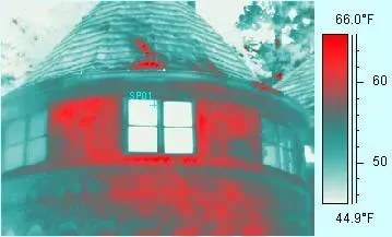 Thermal image of a building, showing heat loss. Red indicates warmer areas like windows, with a temperature scale.