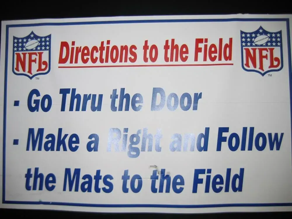 Sign with NFL logos and instructions: 