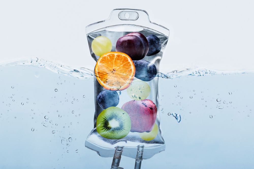 A bag filled with fruit is floating in the water.