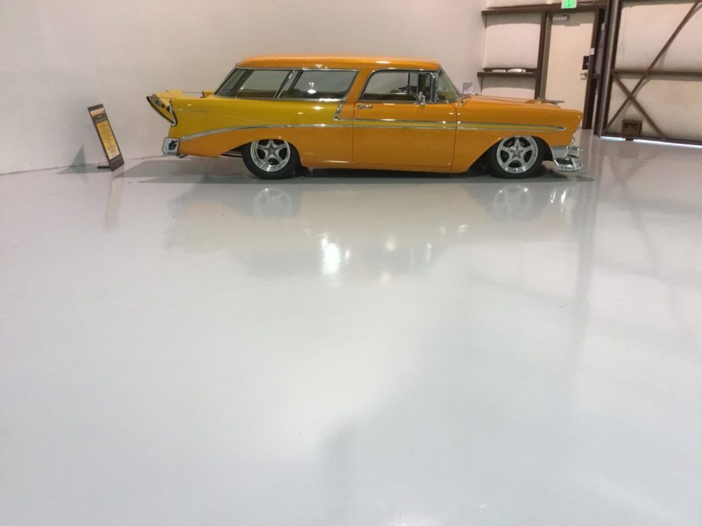 Close-up of a speckled, dark gray surface with a faint light reflection.