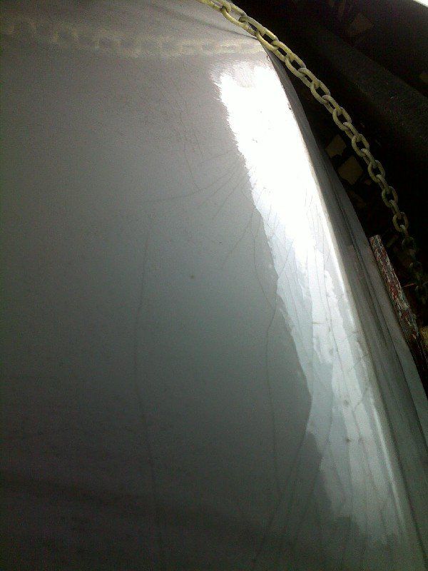 Boat bottom hull with severe fiberglass impact damage