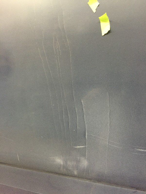 Boat with cracked and damaged fiberglass and gelcoat finish