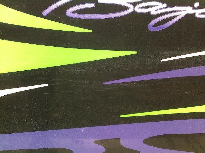 Boat with damage to gelcoat through numerous colors