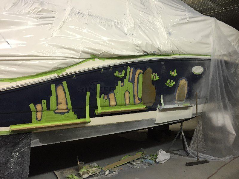 Boat with cracked and damaged fiberglass and gelcoat finish in the repair process