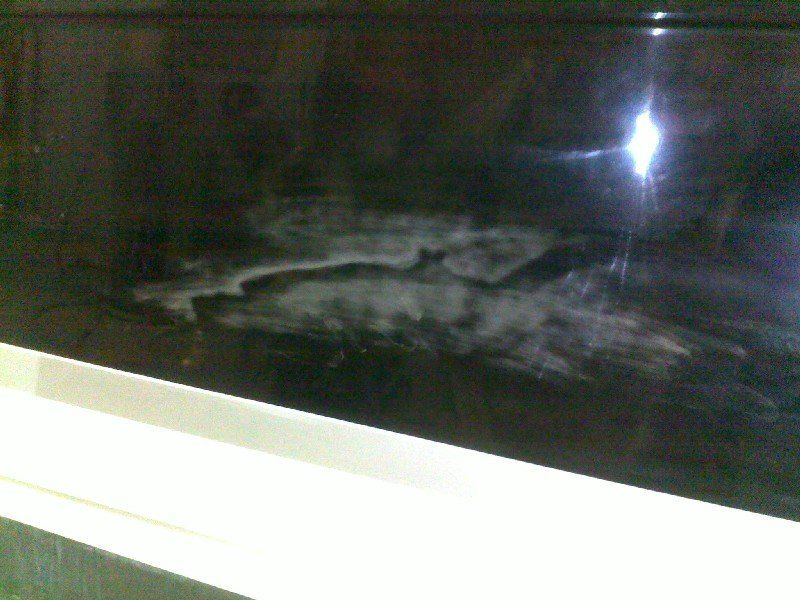 Black base clearcoat damage on boat