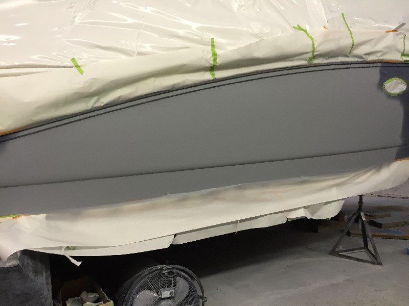 Boat with cracked and damaged fiberglass and gelcoat finish in the repair process