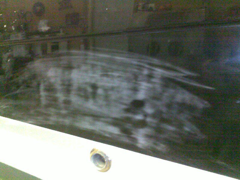 Black base clearcoat damage on boat