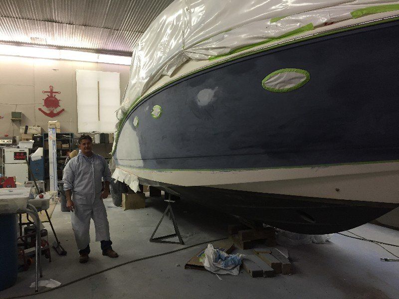 Boat with cracked and damaged fiberglass and gelcoat finish in the repair process