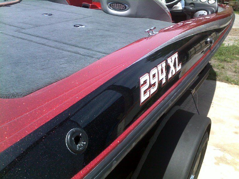 Boat that has had fiberglass and metalflake repaired after impact damage