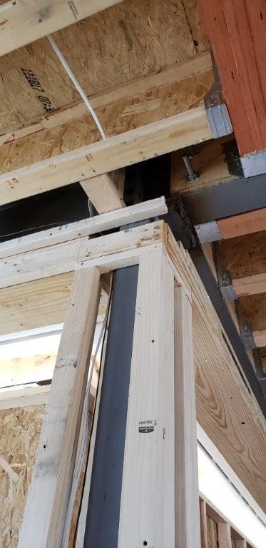 A close up of a wooden structure under construction.