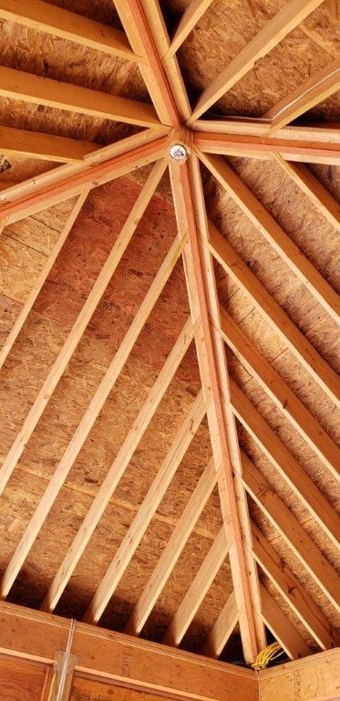 A close up of a wooden roof under construction.