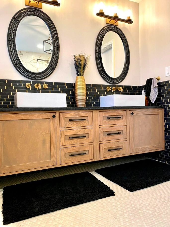 A bathroom with two sinks and two mirrors.