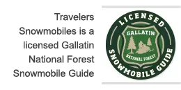 A sign that says travelers snowmobiles is a licensed gallatin national forest snowmobile guide