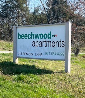 Sign for Beechwood Apartments, 115 Peacock Lane, with phone number 931.684.4299.