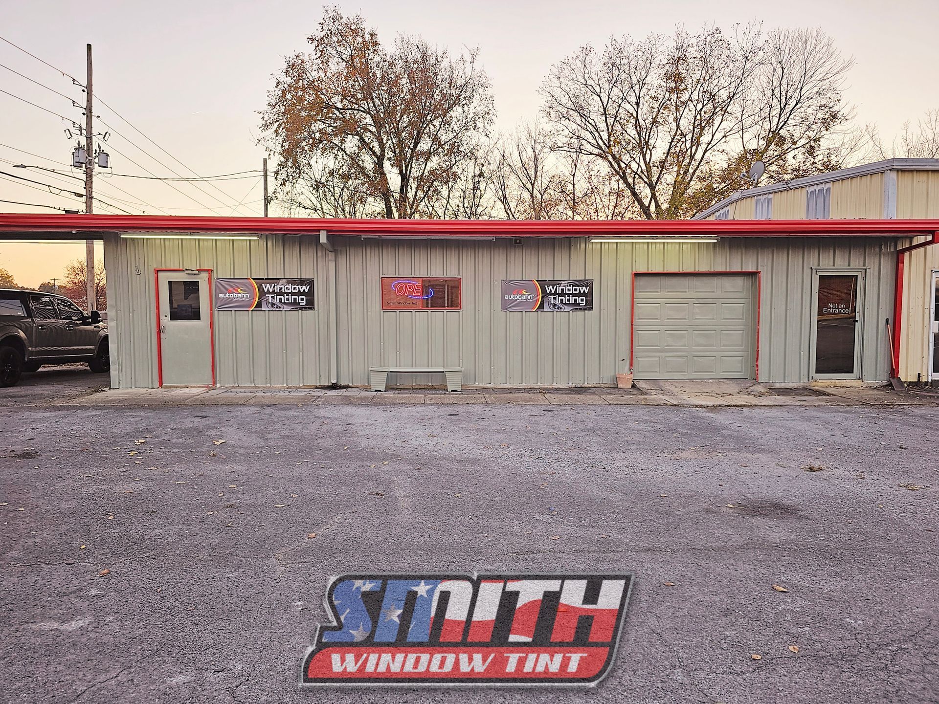 A smith window tint building with a red roof