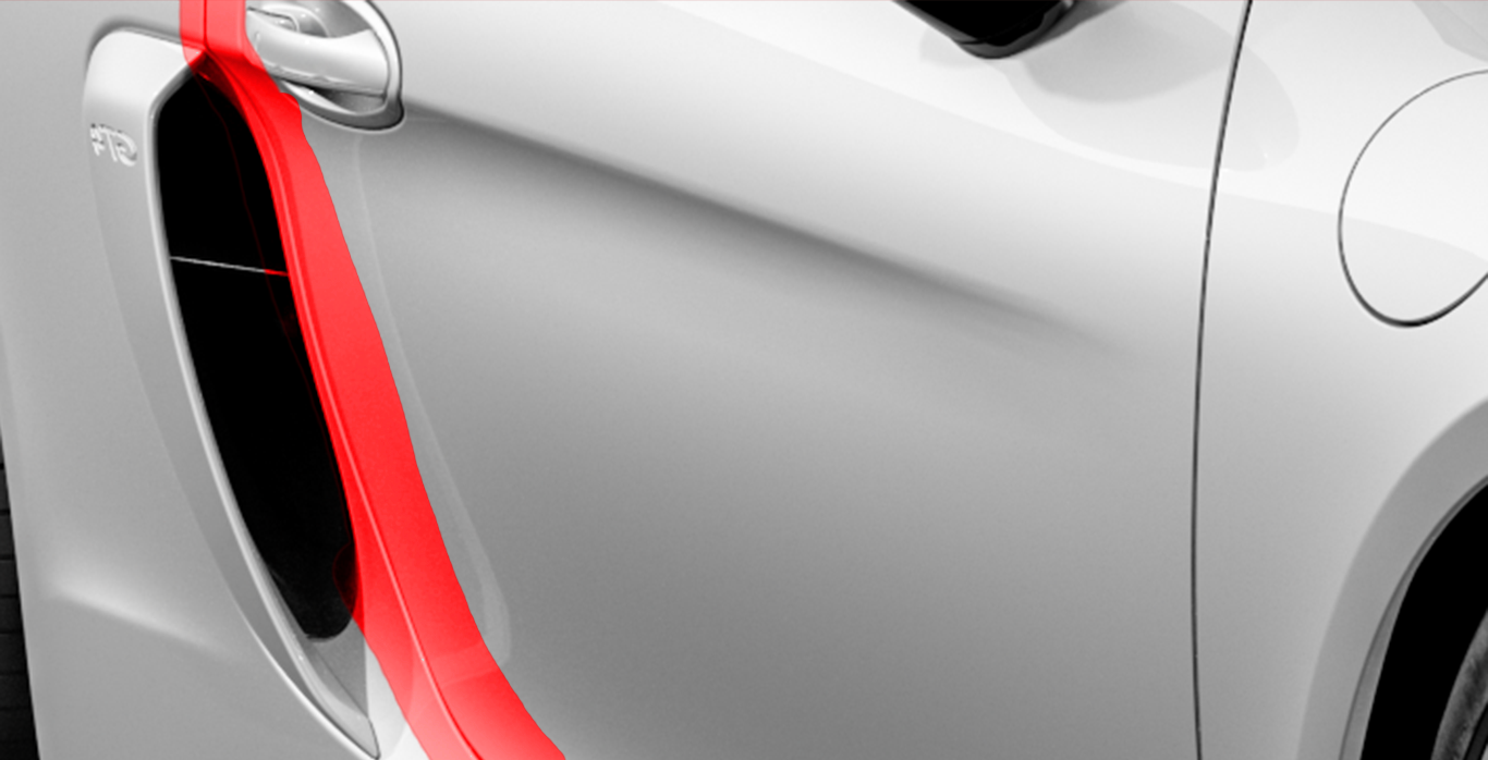 A close up of a white car with a red stripe on the side