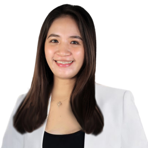 A woman with long brown hair is wearing a white jacket and smiling