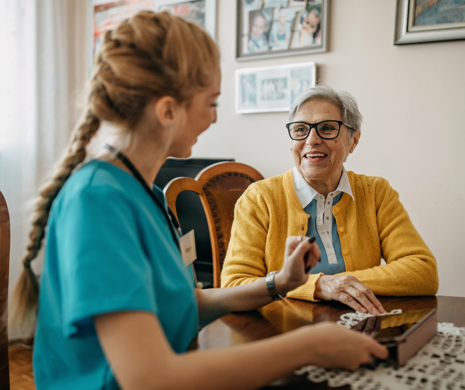 A nurse is playing a game with an elderly woman.